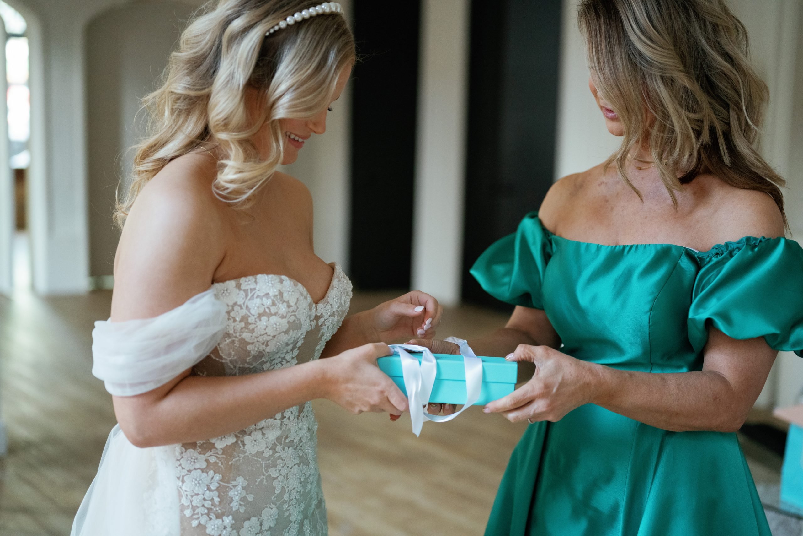 mother gifts her daughter a beautiful bracelet on her wedding day
