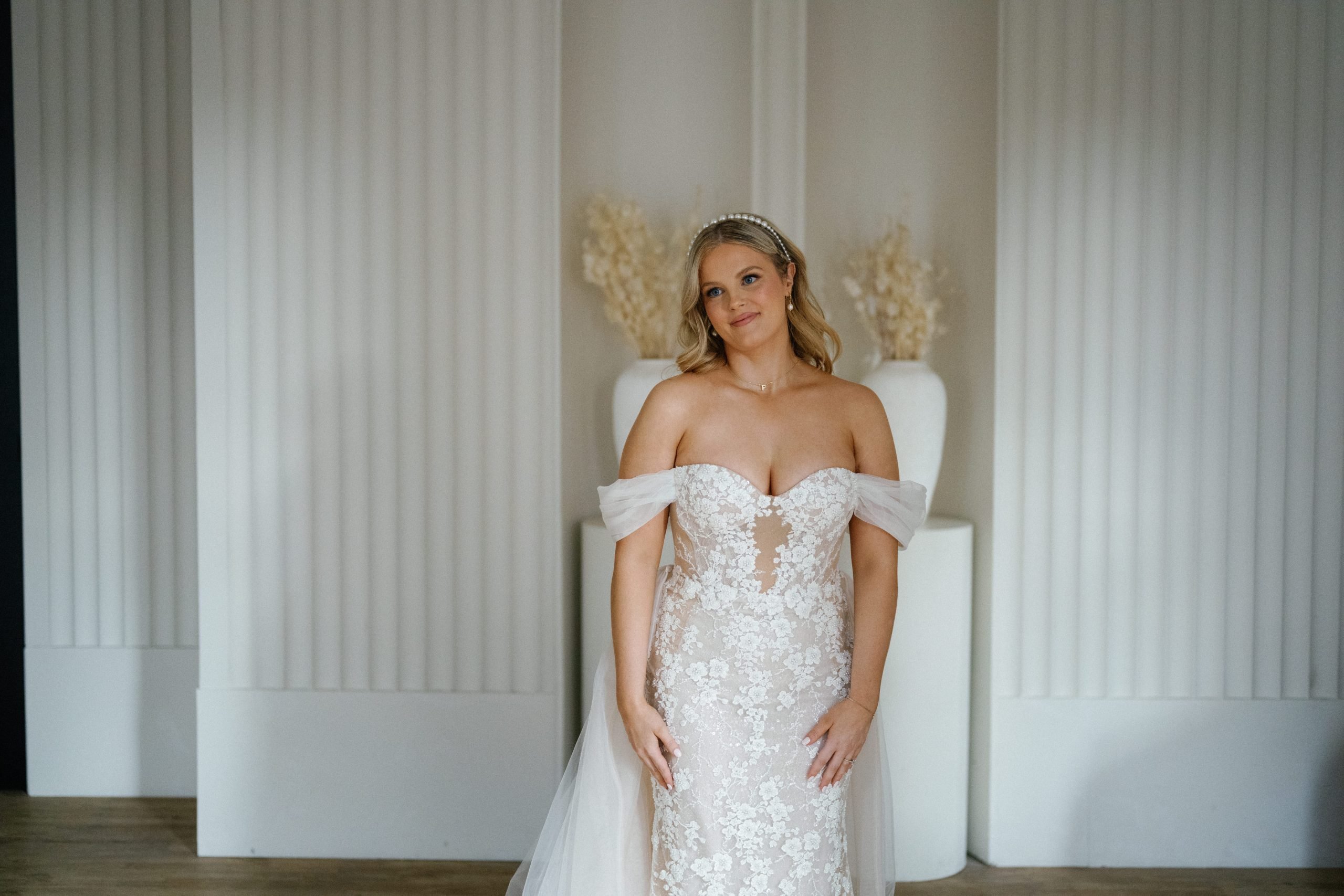 bride with off the shoulder wedding gown before her first look, at Archive Studios