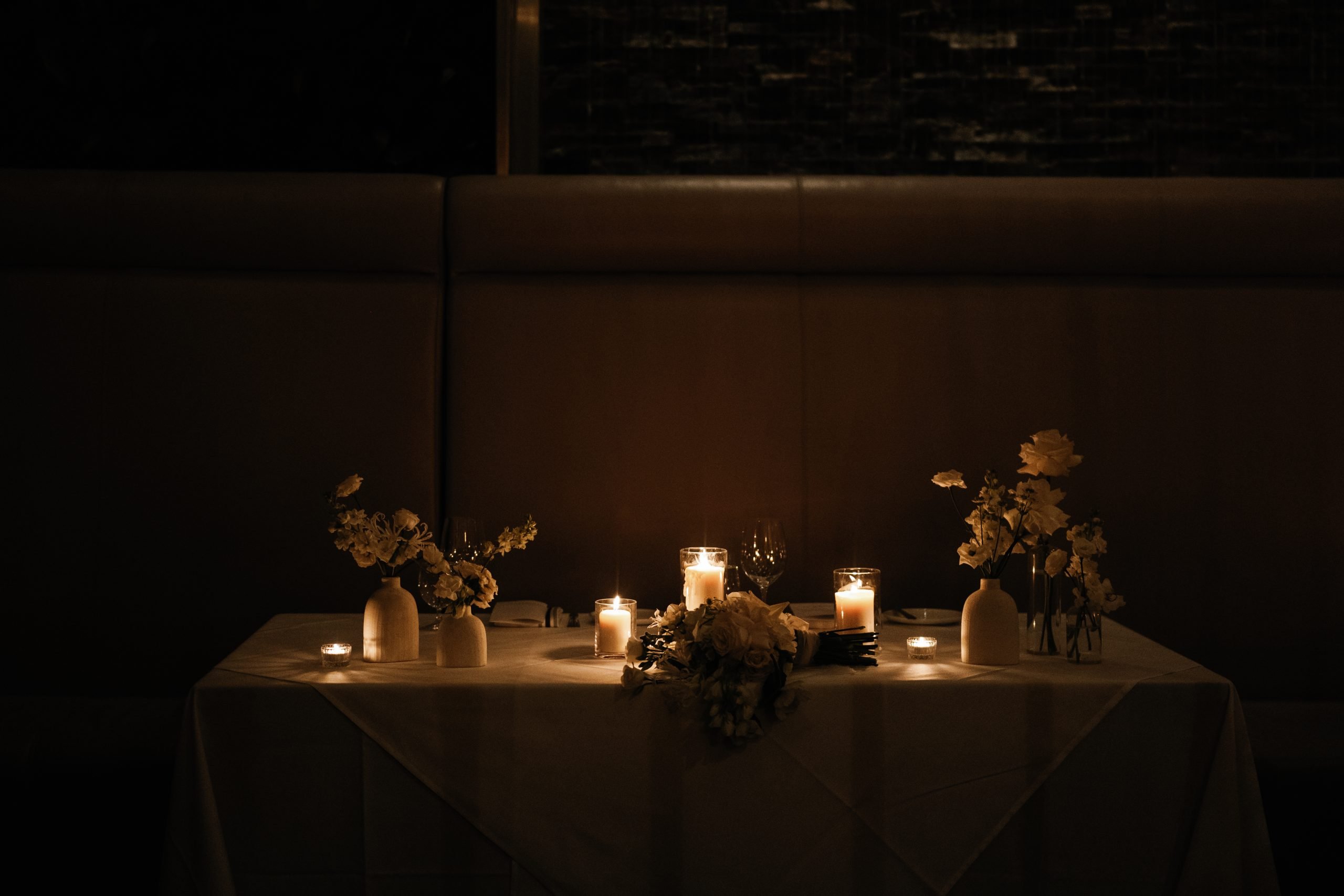 elegant candlelit room at Sassafras, reception ready before guests sit down