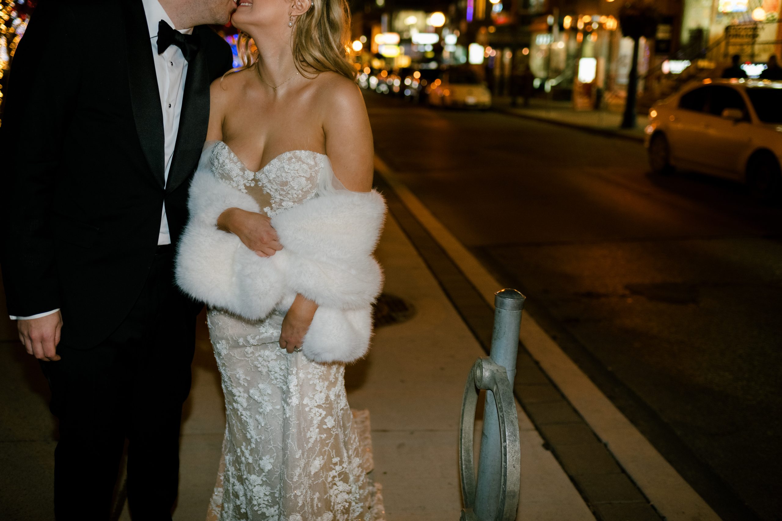 couple walks around Yorkville at night on wedding night