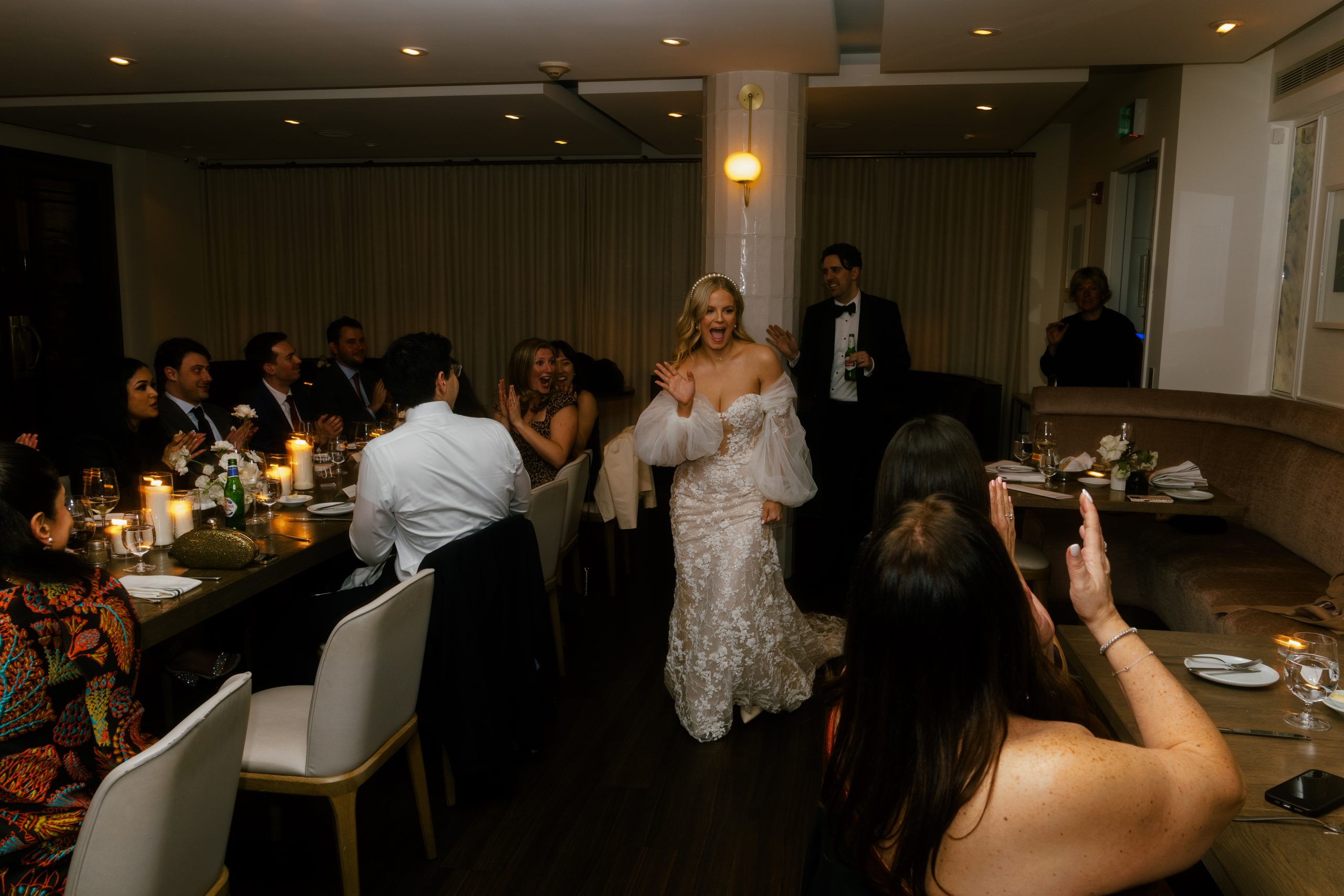 bride and groom enter the reception and greet guests at Sassafras Restaurant in Toronto